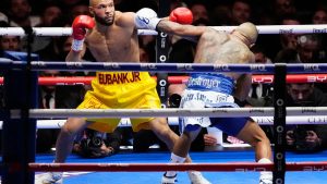 Benn dominates Eubank Jr. to earn bragging rights in British boxing's family feud